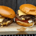 smash burgers on top of a blackstone griddle